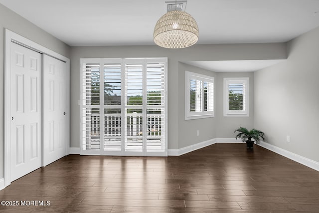 7 Navesink Ct, Long Branch, NJ 07740 - unfurnished dining area with a chandelier and wood finished floors
