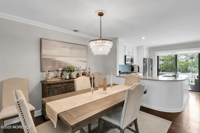 7 Navesink Ct, Long Branch, NJ 07740 - dining area with a chandelier, wood finished floors, recessed lighting, and ornamental molding