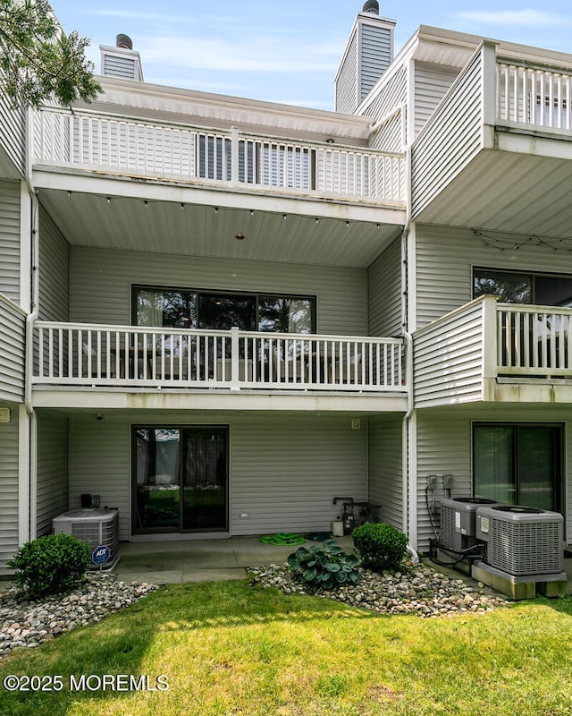 7 Navesink Ct, Long Branch, NJ 07740 - back of house with a balcony, a chimney, and a patio