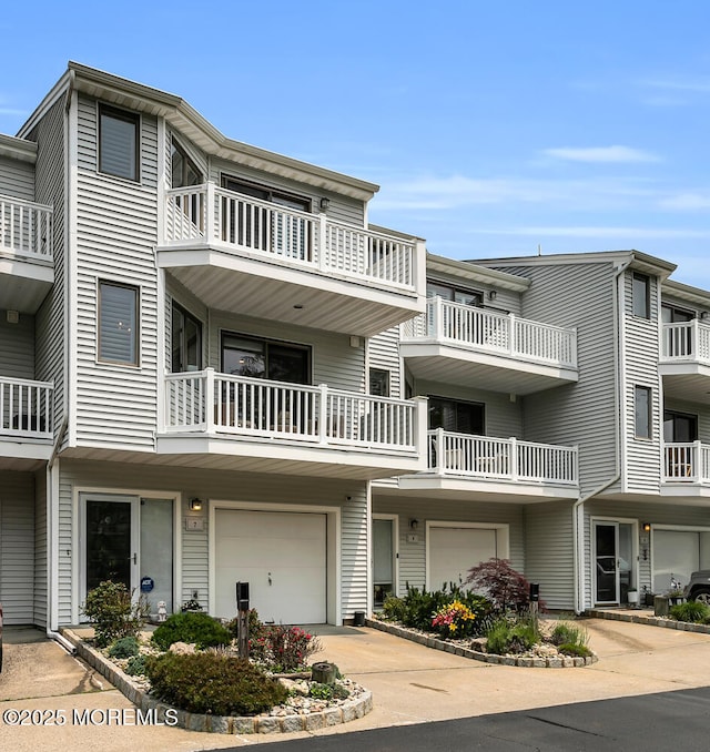 7 Navesink Ct, Long Branch, NJ 07740 - view of front of home with a garage and concrete driveway