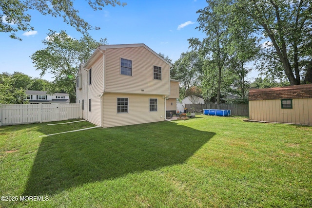 104 Starlight Rd, Howell, NJ 07731 - back of property with a fenced backyard and a storage shed