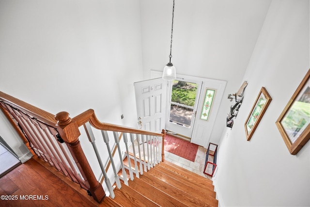 104 Starlight Rd, Howell, NJ 07731 - stairway with wood-type flooring and a towering ceiling