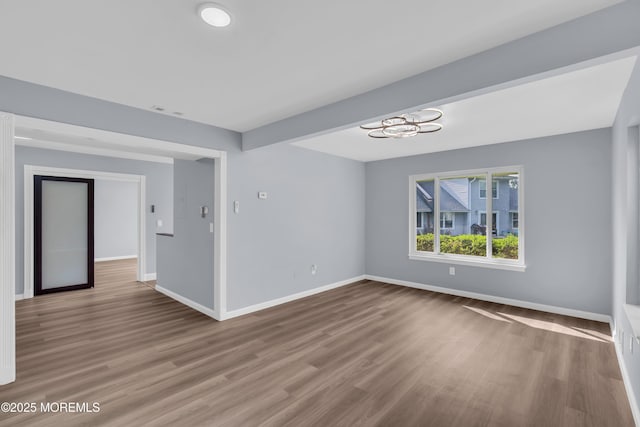 23 Arlene Ct Unit 4103, Brick, NJ 08723 - spare room featuring wood finished floors and a chandelier