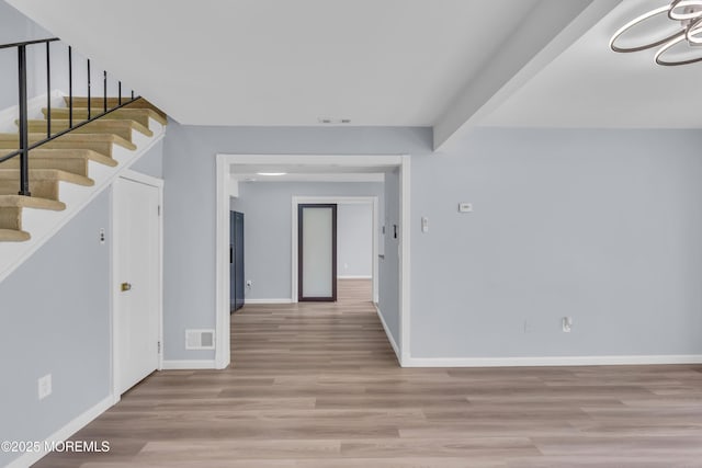 23 Arlene Ct Unit 4103, Brick, NJ 08723 - hallway with light wood-style flooring and stairs