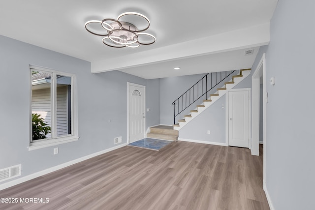 23 Arlene Ct Unit 4103, Brick, NJ 08723 - foyer entrance with stairway, wood finished floors, and a chandelier