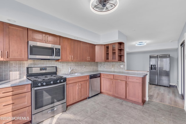 23 Arlene Ct Unit 4103, Brick, NJ 08723 - kitchen featuring stainless steel appliances, backsplash, brown cabinetry, light tile patterned floors, and open shelves