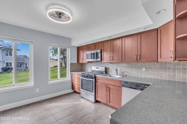 23 Arlene Ct Unit 4103, Brick, NJ 08723 - kitchen with appliances with stainless steel finishes, open shelves, tasteful backsplash, light tile patterned floors, and brown cabinetry