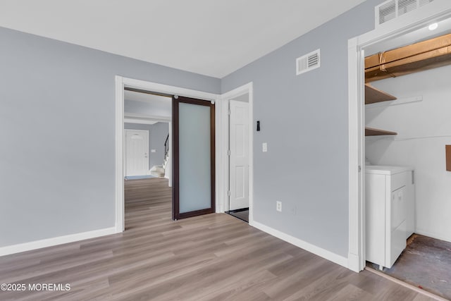 23 Arlene Ct Unit 4103, Brick, NJ 08723 - unfurnished bedroom featuring washer / clothes dryer and wood finished floors