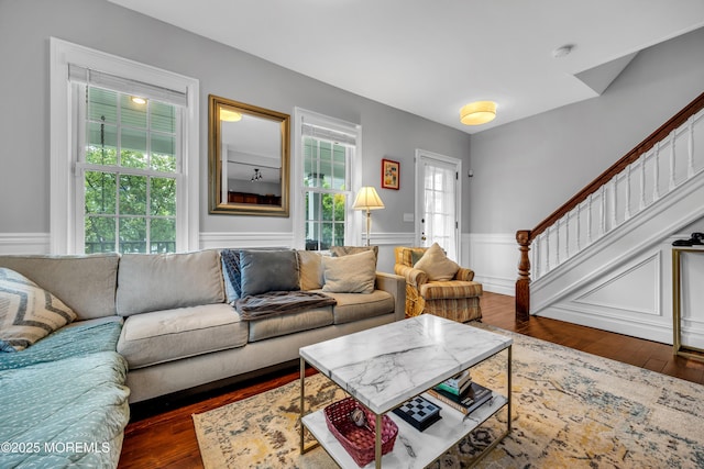 1108 Emory St, Asbury Park, NJ 07712 - living room featuring healthy amount of natural light, wainscoting, stairs, and wood finished floors