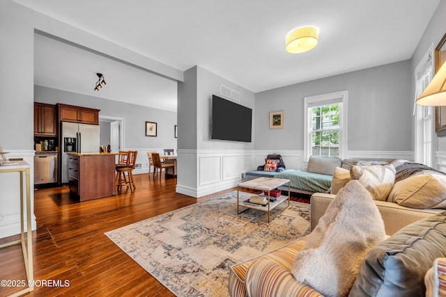 1108 Emory St, Asbury Park, NJ 07712 - living room featuring a wainscoted wall and dark wood-style flooring