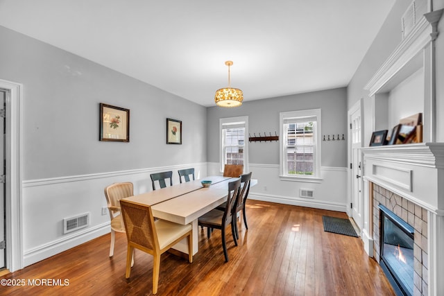 1108 Emory St, Asbury Park, NJ 07712 - dining space featuring hardwood / wood-style flooring and a tile fireplace