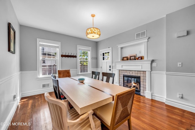 1108 Emory St, Asbury Park, NJ 07712 - dining area featuring wood-type flooring and a tiled fireplace