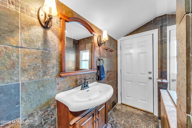 1108 Emory St, Asbury Park, NJ 07712 - bathroom with tile walls, vanity, and lofted ceiling