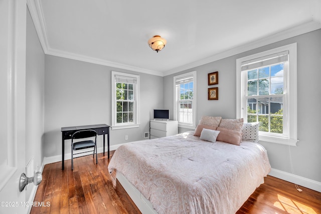 1108 Emory St, Asbury Park, NJ 07712 - bedroom with dark wood-style floors and crown molding