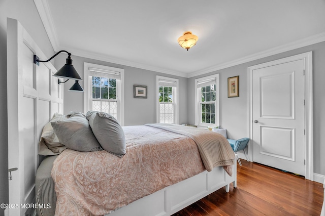 1108 Emory St, Asbury Park, NJ 07712 - bedroom featuring dark wood-style floors, crown molding, and multiple windows