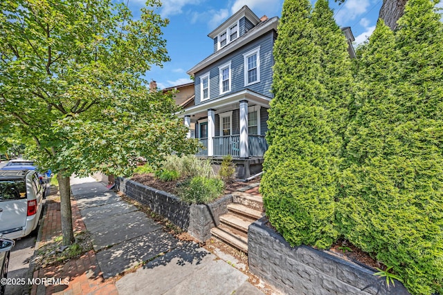 1108 Emory St, Asbury Park, NJ 07712 - view of front of house with a porch