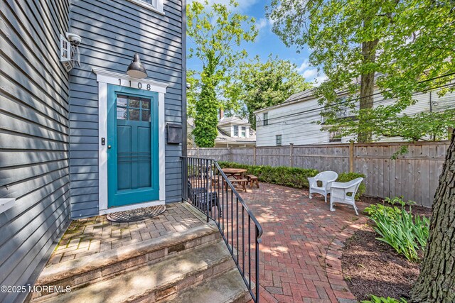 1108 Emory St, Asbury Park, NJ 07712 - doorway to property with a patio and outdoor dining area