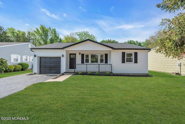 9 Westbrook Dr, Toms River, NJ 08757 - single story home featuring covered porch, a garage, asphalt driveway, and a front yard