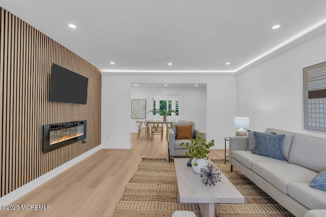 9 Westbrook Dr, Toms River, NJ 08757 - living room with wood finished floors, a glass covered fireplace, and recessed lighting
