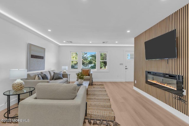 9 Westbrook Dr, Toms River, NJ 08757 - living area featuring light wood finished floors, a glass covered fireplace, and recessed lighting