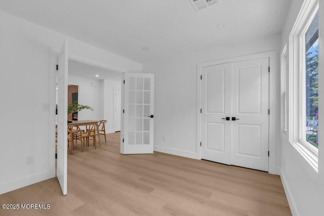 9 Westbrook Dr, Toms River, NJ 08757 - spare room with healthy amount of natural light, light wood-style flooring, and french doors