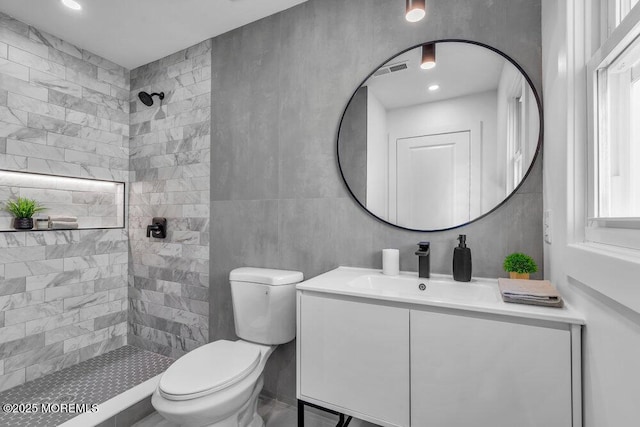 9 Westbrook Dr, Toms River, NJ 08757 - bathroom featuring vanity, a tile shower, and tile walls