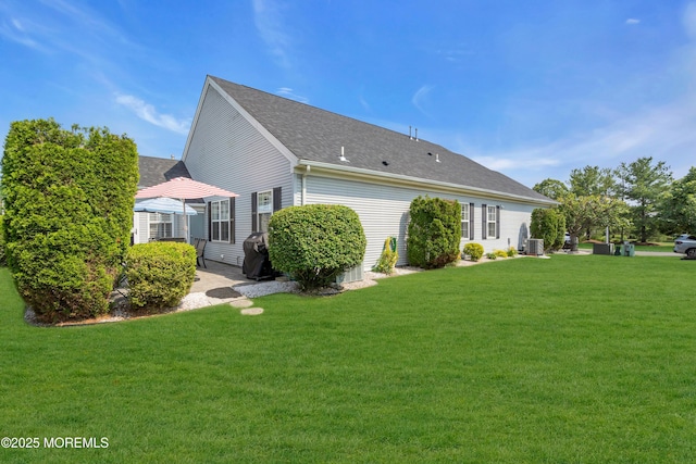 20 Chaucer Cir, Manchester, NJ 08759 - back of house featuring a yard and a shingled roof