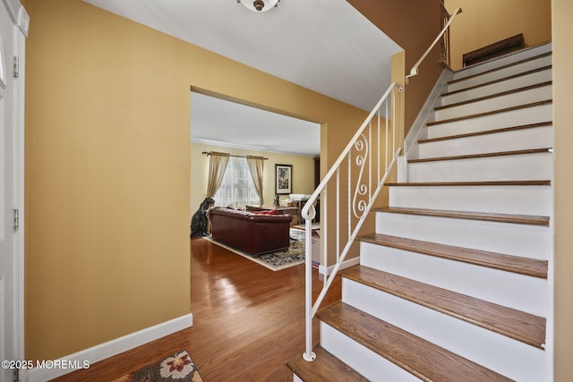 74 Kingsley Way, Freehold, NJ 07728 - stairs featuring wood finished floors and baseboards