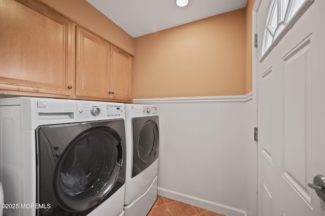 74 Kingsley Way, Freehold, NJ 07728 - laundry area with washer and dryer, cabinet space, light tile patterned flooring, and a wainscoted wall