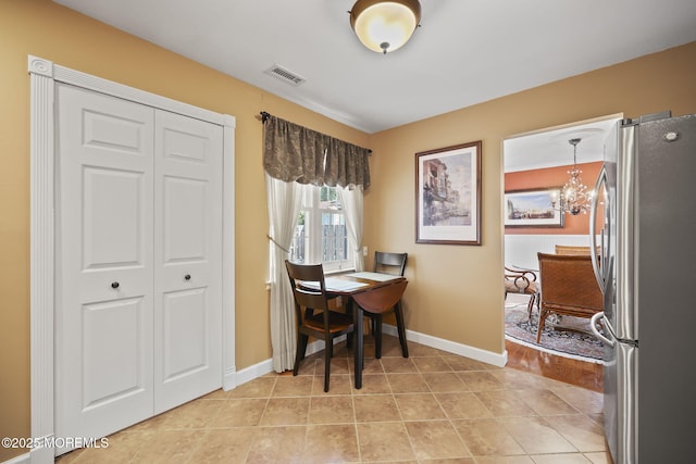 74 Kingsley Way, Freehold, NJ 07728 - dining area featuring a chandelier and light tile patterned flooring