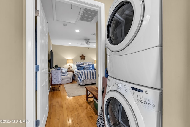 702 Saint Louis Ave, Point Pleasant Beach, NJ 08742 - laundry area with stacked washer and clothes dryer, light wood-style flooring, recessed lighting, a ceiling fan, and attic access