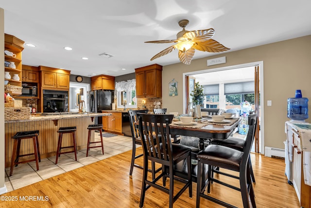 702 Saint Louis Ave, Point Pleasant Beach, NJ 08742 - dining space featuring recessed lighting, a baseboard radiator, a ceiling fan, and light wood-style floors