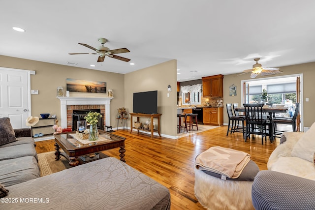 702 Saint Louis Ave, Point Pleasant Beach, NJ 08742 - living area with a ceiling fan, recessed lighting, a fireplace, and light wood-type flooring