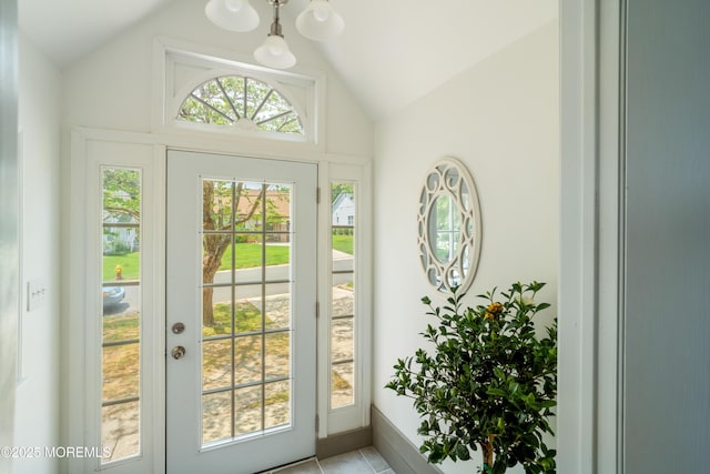19 Cedar Ave, Manahawkin, NJ 08050 - doorway to outside featuring vaulted ceiling, a chandelier, and light tile patterned floors