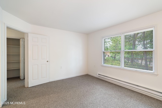 19 Cedar Ave, Manahawkin, NJ 08050 - unfurnished bedroom featuring baseboard heating, carpet, and a walk in closet
