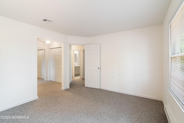 19 Cedar Ave, Manahawkin, NJ 08050 - carpeted spare room with a baseboard radiator and baseboards