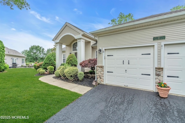 11 High Hill Ct, Manchester, NJ 08759 - view of front of home with a front lawn, asphalt driveway, and an attached garage