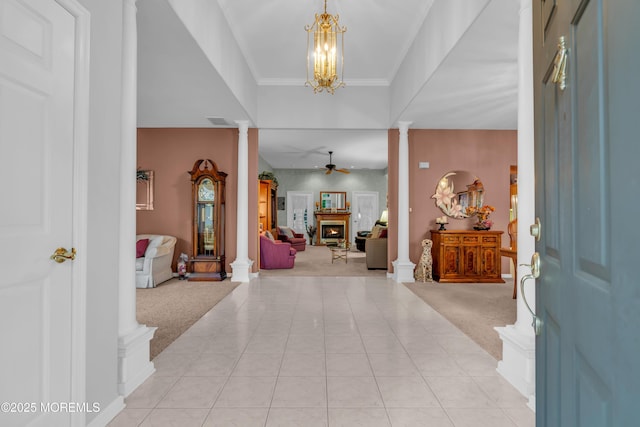 11 High Hill Ct, Manchester, NJ 08759 - entrance foyer with ornate columns, light colored carpet, ceiling fan, and a chandelier