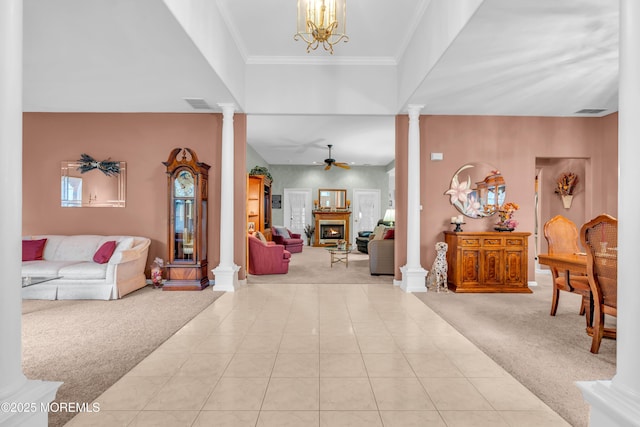11 High Hill Ct, Manchester, NJ 08759 - carpeted foyer featuring decorative columns, ceiling fan, a lit fireplace, a chandelier, and ornamental molding