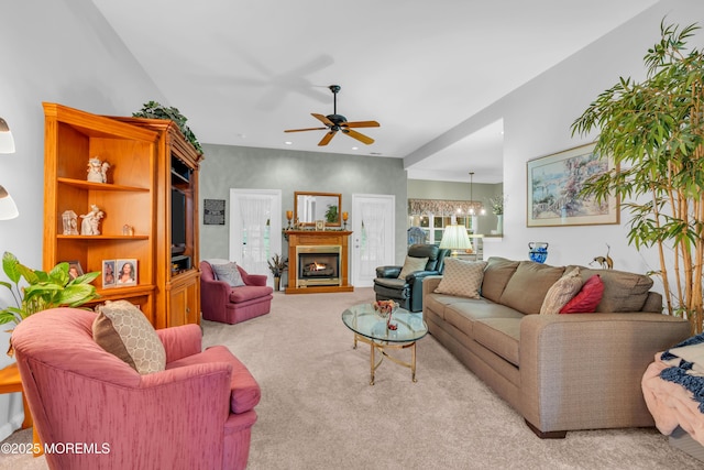 11 High Hill Ct, Manchester, NJ 08759 - carpeted living area with a ceiling fan, a chandelier, and a warm lit fireplace