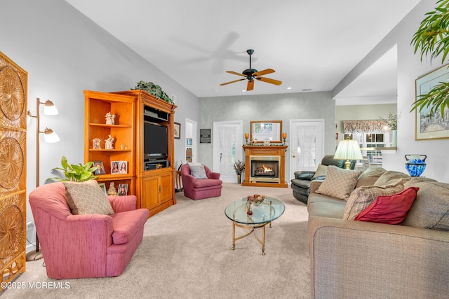 11 High Hill Ct, Manchester, NJ 08759 - living room with carpet, a ceiling fan, and a warm lit fireplace
