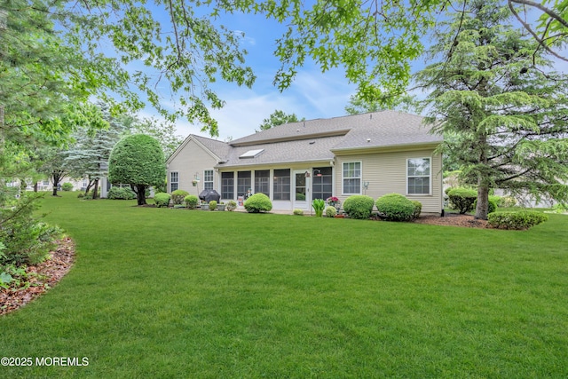 11 High Hill Ct, Manchester, NJ 08759 - rear view of property featuring a lawn, roof with shingles, and a sunroom