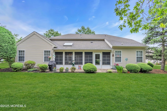 11 High Hill Ct, Manchester, NJ 08759 - back of property with a lawn, a sunroom, and roof with shingles