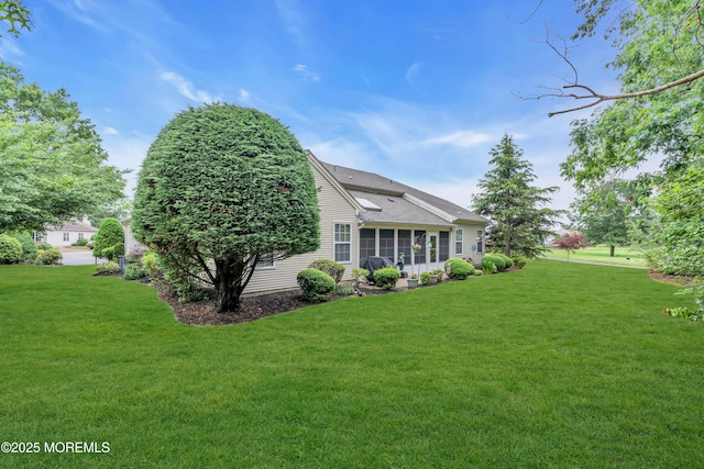 11 High Hill Ct, Manchester, NJ 08759 - view of side of home with a yard, a sunroom, and roof with shingles