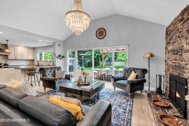 1159 County Line Rd E, Lakewood, NJ 08701 - living room with a chandelier, high vaulted ceiling, a fireplace, and recessed lighting