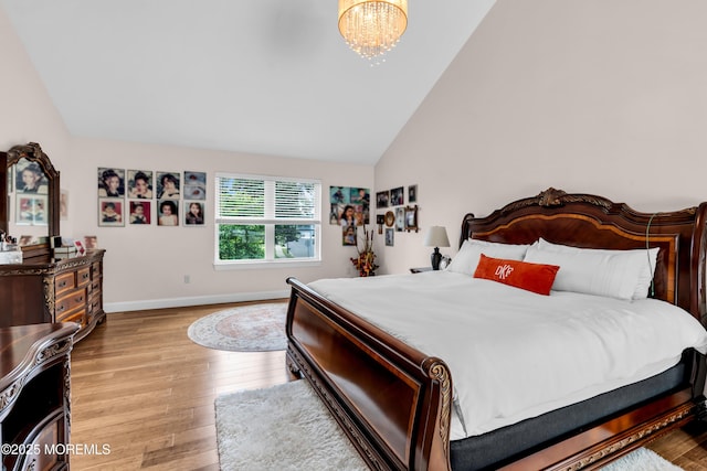 1159 County Line Rd E, Lakewood, NJ 08701 - bedroom featuring wood finished floors, a chandelier, and vaulted ceiling