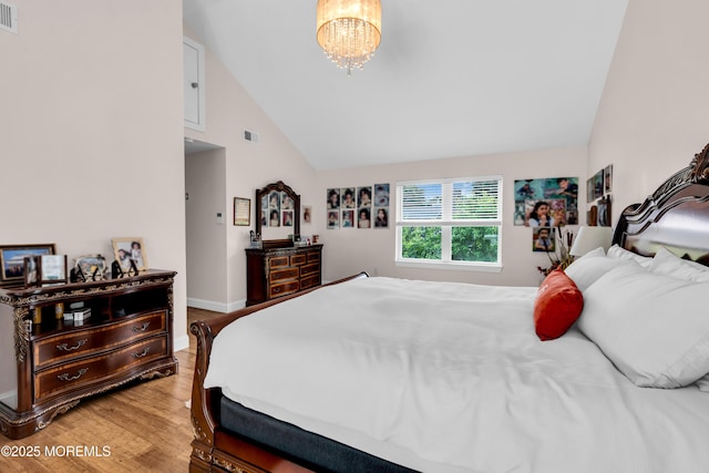 1159 County Line Rd E, Lakewood, NJ 08701 - bedroom with light wood-style floors, high vaulted ceiling, and a chandelier