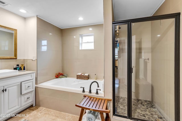 1159 County Line Rd E, Lakewood, NJ 08701 - full bath with a garden tub, vanity, a stall shower, and tile patterned floors