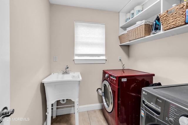 1159 County Line Rd E, Lakewood, NJ 08701 - laundry area with separate washer and dryer and baseboards