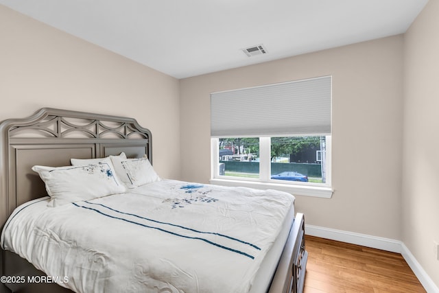 1159 County Line Rd E, Lakewood, NJ 08701 - bedroom featuring baseboards and wood finished floors